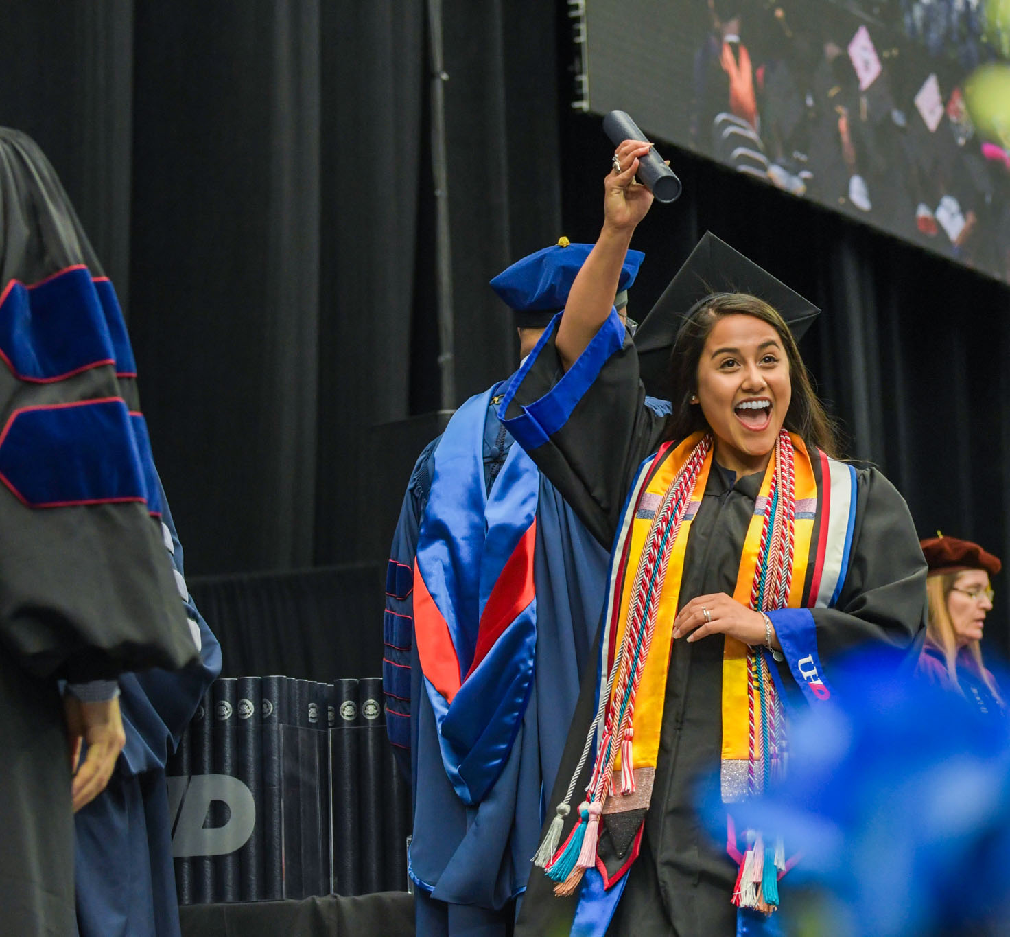 Graduation caps held in the sky