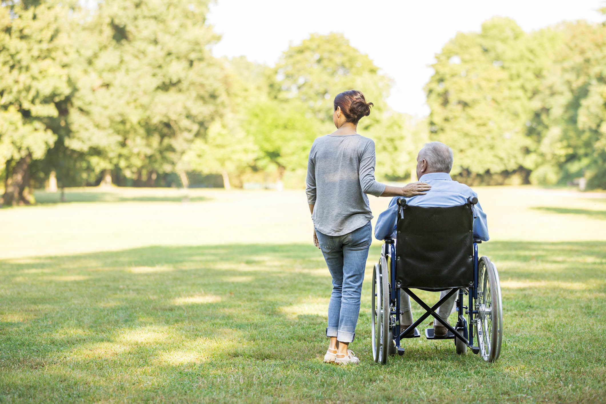 Social Worker with client in wheelchair at the park