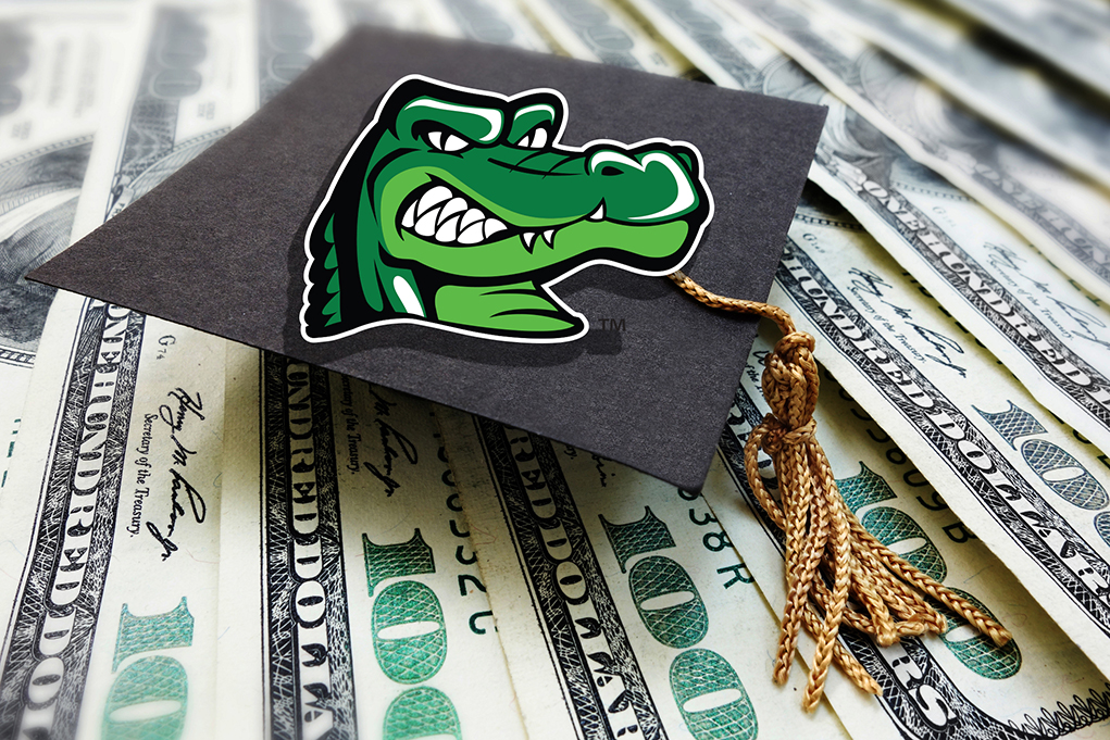 graduation cap with gator logo on top of money