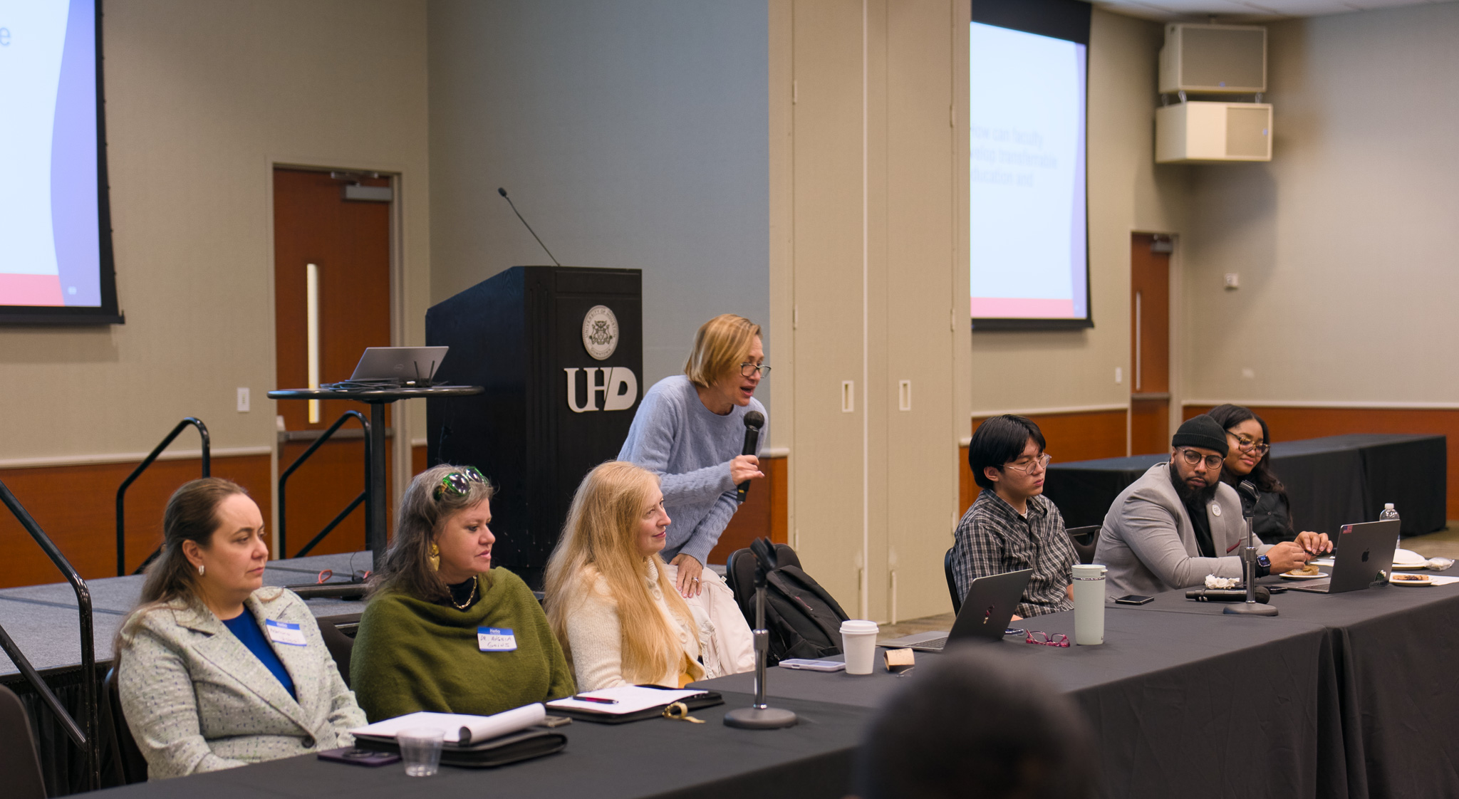 Students engaging in table discussions during the event