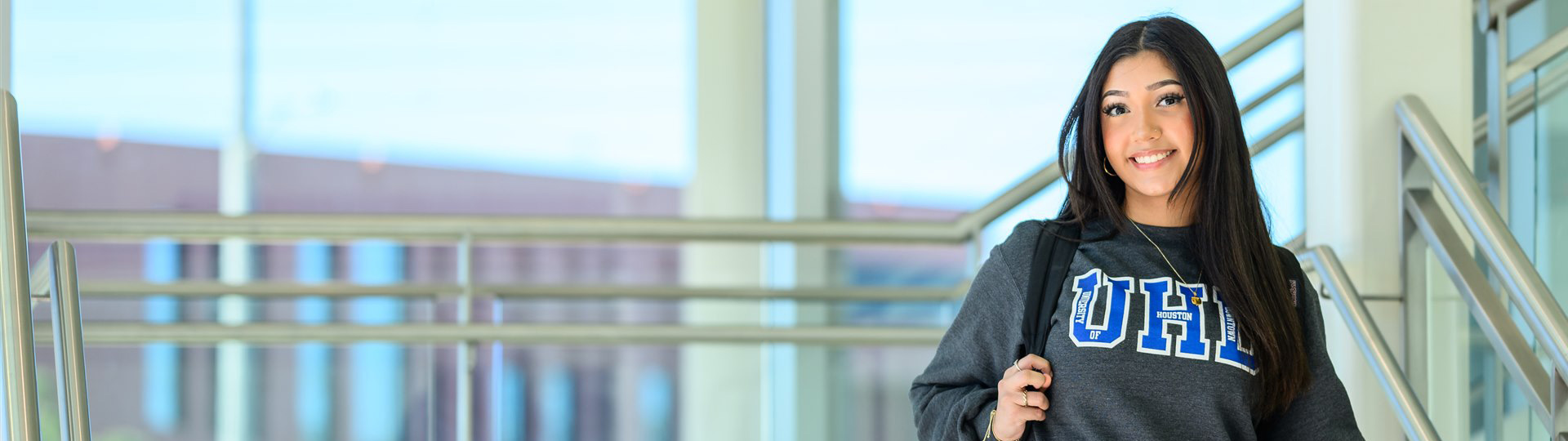 UHD student going down the stairs