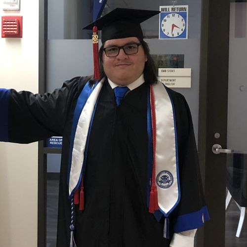 Leija wearing a graduation cap and gown