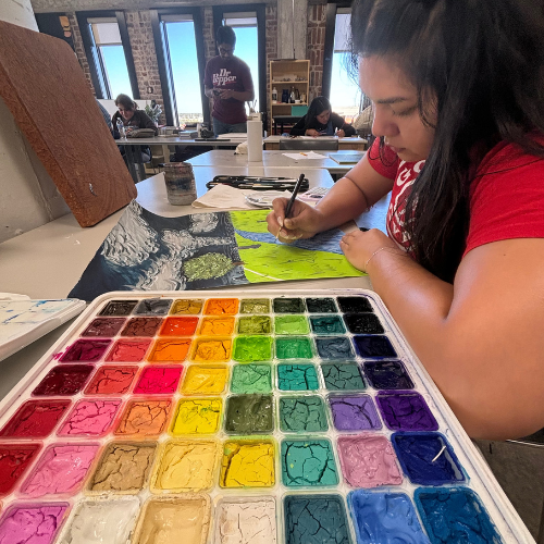 Art student painting a landscape