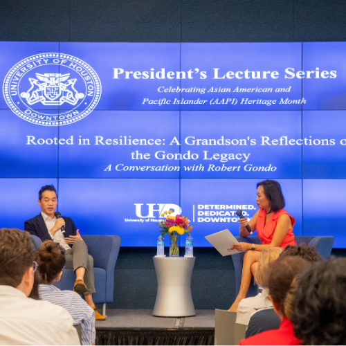 Robert Gondo sits aside news anchor Miya Shay at the Asian American and Pacific Islander Heritage Month Presidents Lecture Series at the University of Houston Downtown.