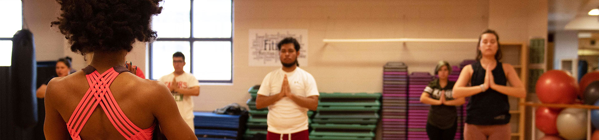 group of students doing yoga