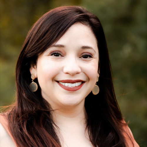UHD College of Public Service Faculty Member Dr. Liza Lane smiles outside 