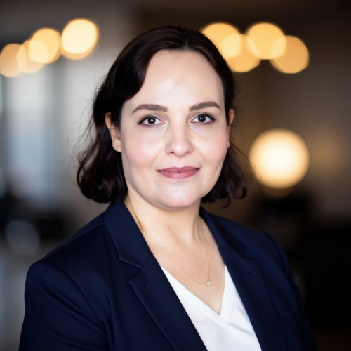 Armiti Rashidi, University of Houston Downtown staff member and MBA student at Marilyn Davies College of Business, smiles.