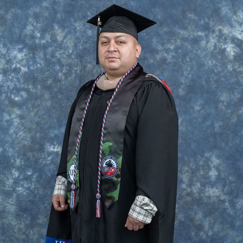 Ever Alvarado wears graduation regalia and veteran's stole at University of Houston Downtown's 78th commencement ceremony at NRG