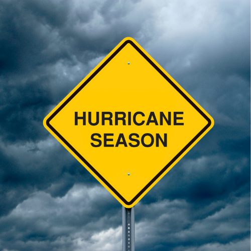 Stormy sky with clouds and a road sign that reads, 