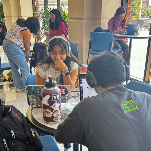 Students sit at tables at the Skyline Lounge on the University of Houston Downtown campus in One Main Building