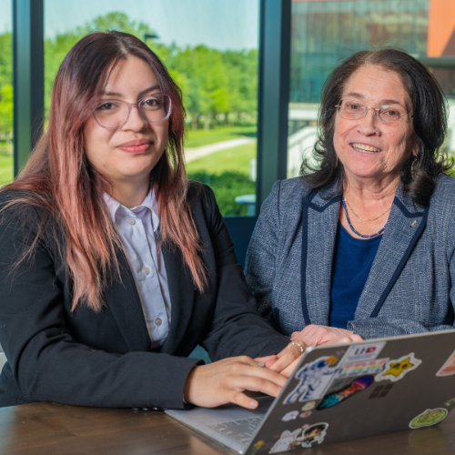 Mary jo parker executive director of uhd's scholars academy sits aside Computer Science major Jessica Gonzalez