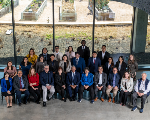 Ted Bauer Undergraduate Emerging Scholars, funders, and the University of Houston-Downtown staff and admin smile at the College of Sciences and Technology at the University of Houston-Downtown