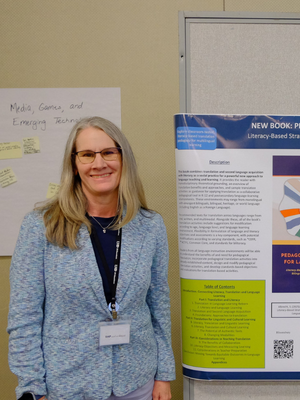 Sarah Albrecht stands aside a research poster at Spring 2026 Organized Research and Creative Activities Symposium at the University of Houston-Downtown